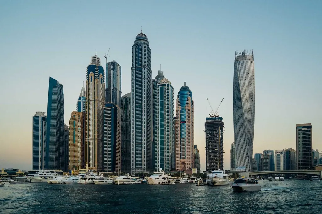 Dubai Marina skyline with towers and yachts at dusk