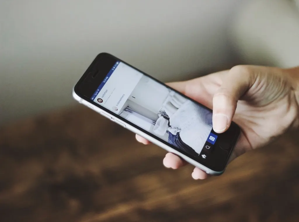 Person browsing Instagram on a smartphone